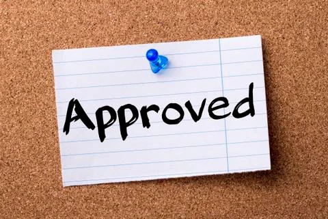 Approved - teared note paper pinned on bulletin board Stock Photos