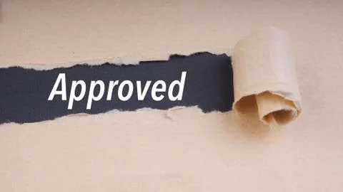 APPROVED text on brown envelope and torn paper. Concept Image 库存照片