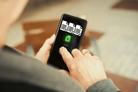 Approving documents on smartphone. Stock Photos
