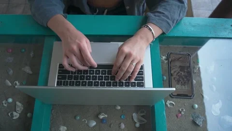 An approximate plan of women's hands that confidently type on a laptop Video stock 234022022