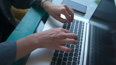 An approximate plan of women's hands that quickly type on a portable computer Video stock 234021692