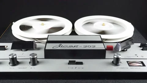 Approximation of an Old Reel Tape Recorder While Rewinding a Reel Tape. Stock Footage 231477227
