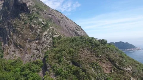 Approximation of Pão de Açúcar, on the east side. Zoom out. Stock Footage 81136621