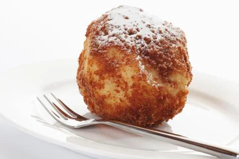 Apricot dumpling in plate with fork Stock Photos