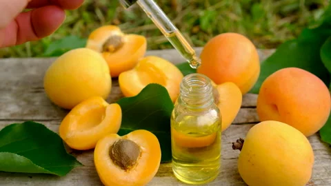 Apricot essential oil in a bottle. Selective focus. Stock Footage 317909675
