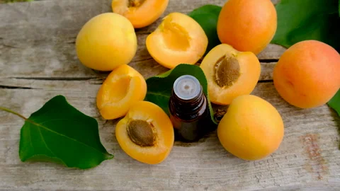 Apricot essential oil in a bottle. Selective focus. Stock Footage 317909927