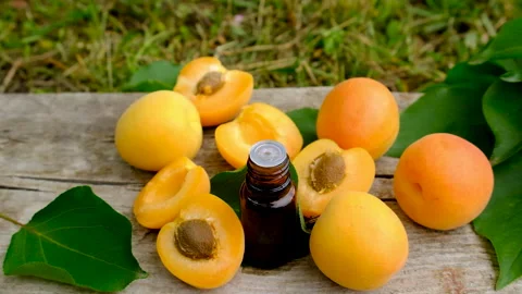 Apricot essential oil in a bottle. Selective focus. Stock Footage 317909972