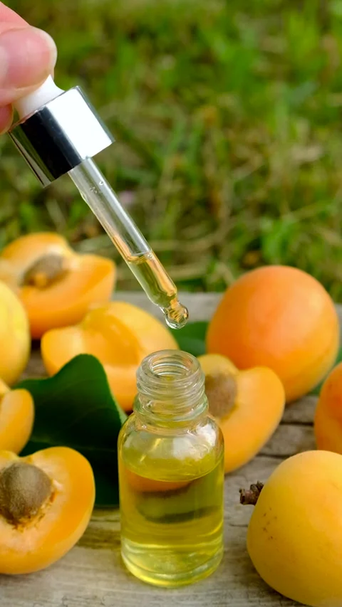 Apricot essential oil in a bottle. Selective focus. Stock Footage 317910028