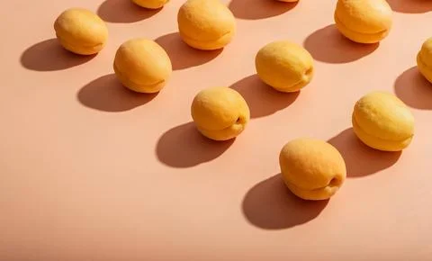 Apricots pattern on a beige background 写真素材
