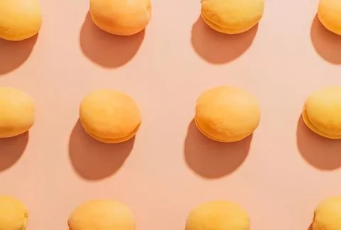 Apricots pattern on a beige background Stockfoto's