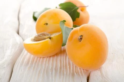 Apricots on a white table Stock Photos