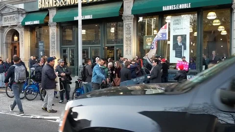 April 18, 2018 James Comey Book Signing, NYC Protesters Donald Trump &amp; NYPD Stock Footage 88661015