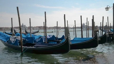 April 2017 - Gondolas and view to Chiesa di San Giorgio Maggiore Church of San Stock Footage 76845129