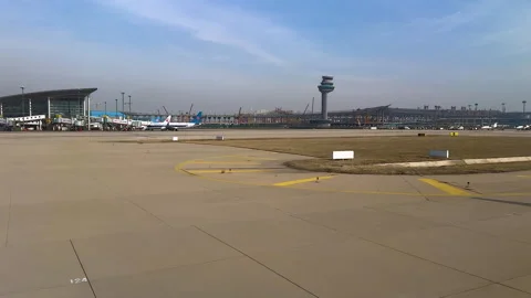 Apron, control tower, new terminal under construction and runway Stock Footage 298177058