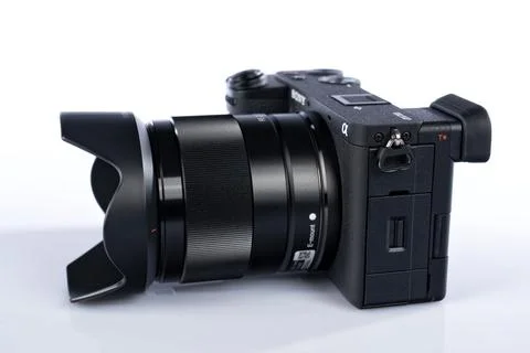 APS-C mirrorless Sony a6700 photo camera with the Sony FE 28 mm F2 lens att.. Stock Photos