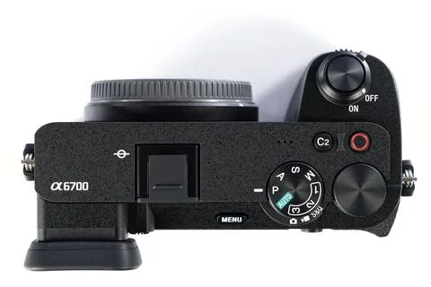 APS-C mirrorless Sony a6700 photo camera isolated on white Stock Photos
