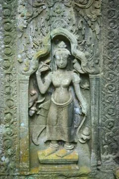 Apsara in bas-relief at Ta Prohm temple ruins, Cambodia. Photos