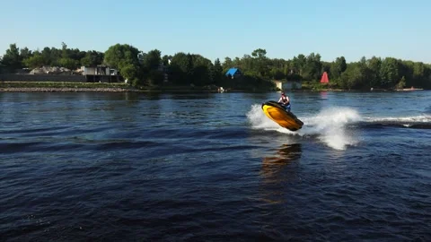 Aquabike jumps on the waves. 4K. Stock Footage 254001650