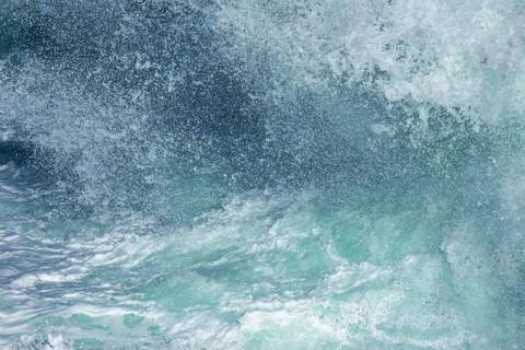 Aquatic background of sea surf waves splashing clear blue green water Stock Photos