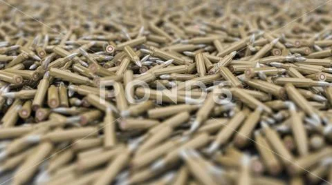 AR-15 Ammo Pile with Brass Casing and Silver Bullet - Shallow DOF ~ Hi Res  #94688158