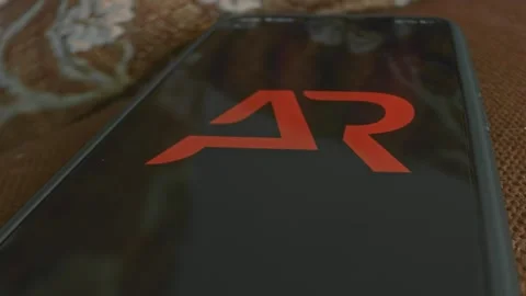 AR Augmented Reality themed graphic presentation on smartphone Stock Footage 303425354
