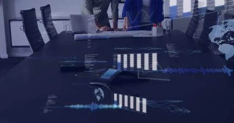 AR graphs activating over table, man and woman leaning, reviewing plans for Stock Footage 330936354