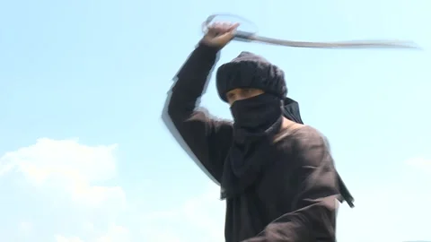Arab assassin wawing with sward Stock Footage 140598577