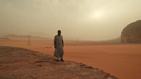 Arab Bedouin walking in the Desert Stock Footage 271595257