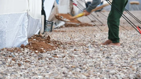 Arab boy digs around the tent. November 9, 2017, Mosul, Iraq. Stock Footage 158377046