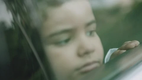 Arab Boy looking out car window Stock Footage 105802743