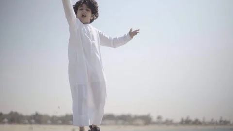 Arab boy playing with sand. Stock Footage 105781238