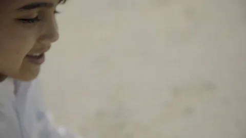 Arab boy playing with sand. Stock Footage 108256855
