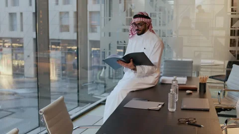 Arab Businessman Proofreading Documents at Modern Office Video stock 304313728