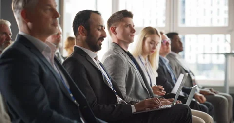 Arab Businessman Using Laptop At Crowded Tech Conference Stock Footage 255840832