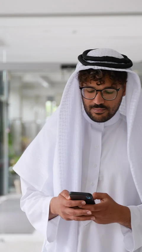 Arab businessman using smartphone and talking on phone Stock Footage 316745877