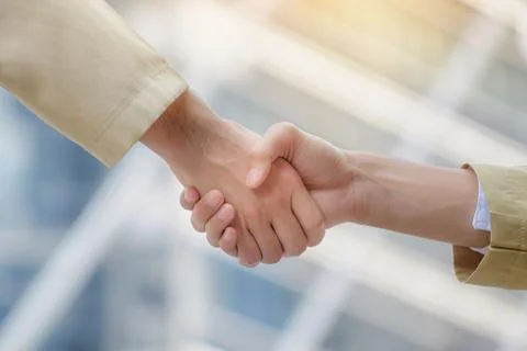 Arab businessmen shake hands and accept business deals for teamwork. Stock Photos