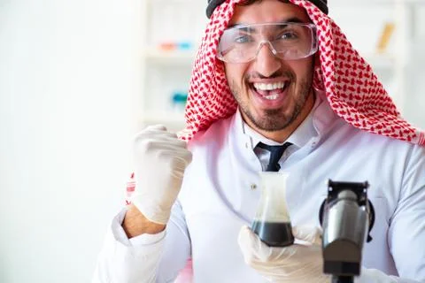 Arab chemist scientist testing quality of oil petrol Stock Photos