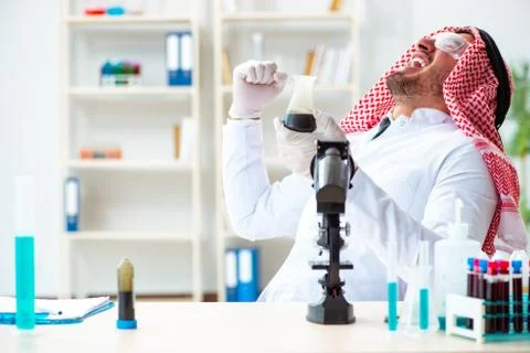 Arab chemist scientist testing quality of oil petrol Stock Photos