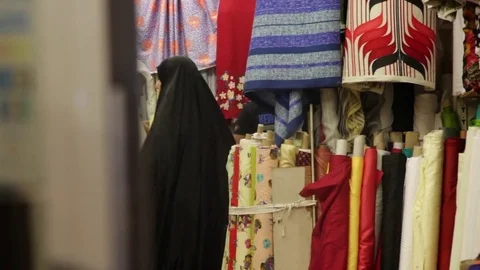Arab Couple choosing Fabrics in the store Stock Footage 74183159