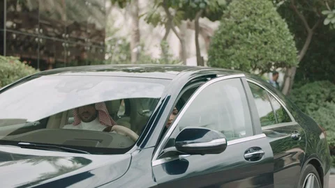 Arab Couple getting out of car Video stock 105803269