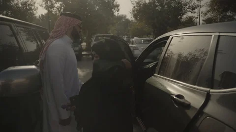 Arab couple getting out of car. Stock Footage 108256983