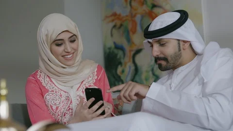 Arab couple looking at mobile. Stock Footage 88106317