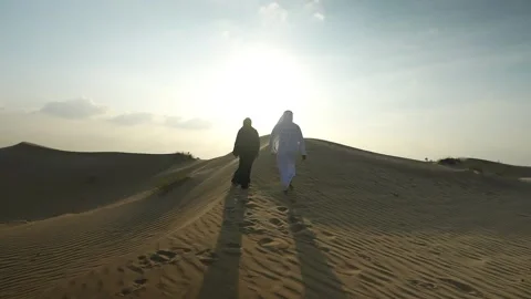 Arab couple walking in the desert. Stock Footage 235017600
