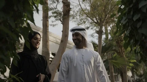Arab couple walking in a garden. Stock Footage 105805737