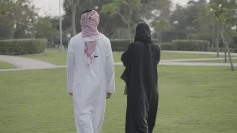 Arab couple walking in the park. Stock Footage 303638122