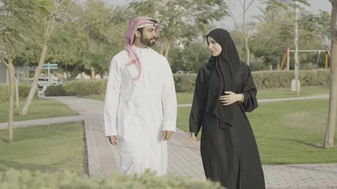 Arab couple walking in the park. Stock Footage 303638204