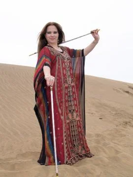 Arab dancer with batons and robe Stock Photos