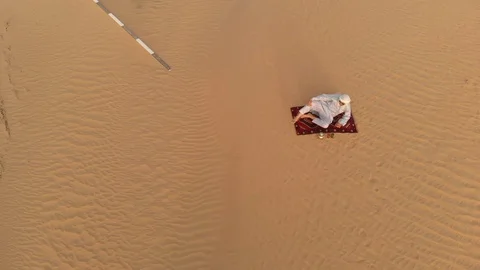 Arab in a desert drinking tea Stock Footage 94410092