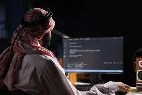Arab Developer Compiling Code Stock Photos
