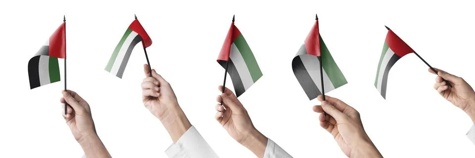 The Arab Emirates flag in hand in different angles on a white background Illustrazione stock